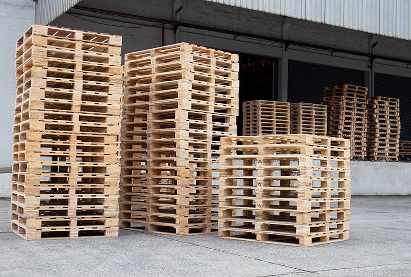 Pallet Stacks Near Loading Bay - Texas Pallets LLC